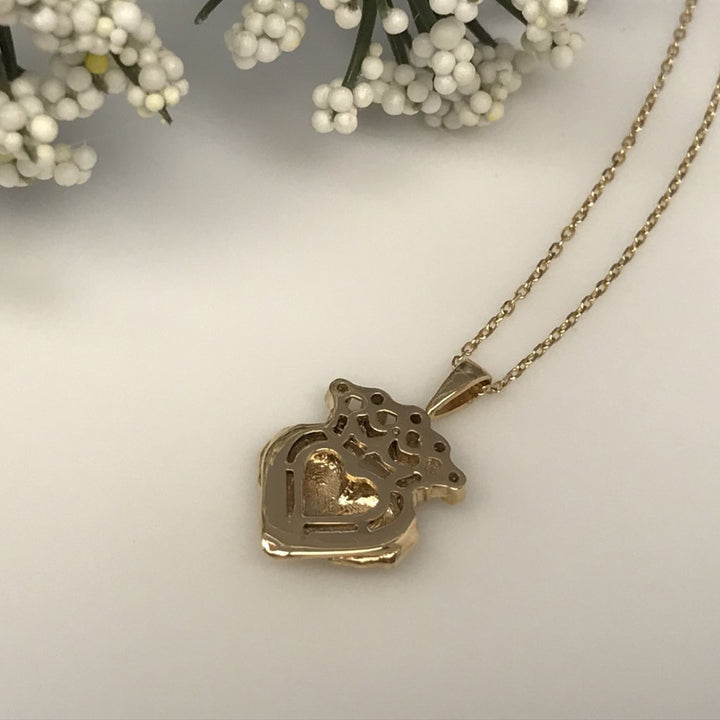 Irish Claddagh pendant necklace with green and white gemstones