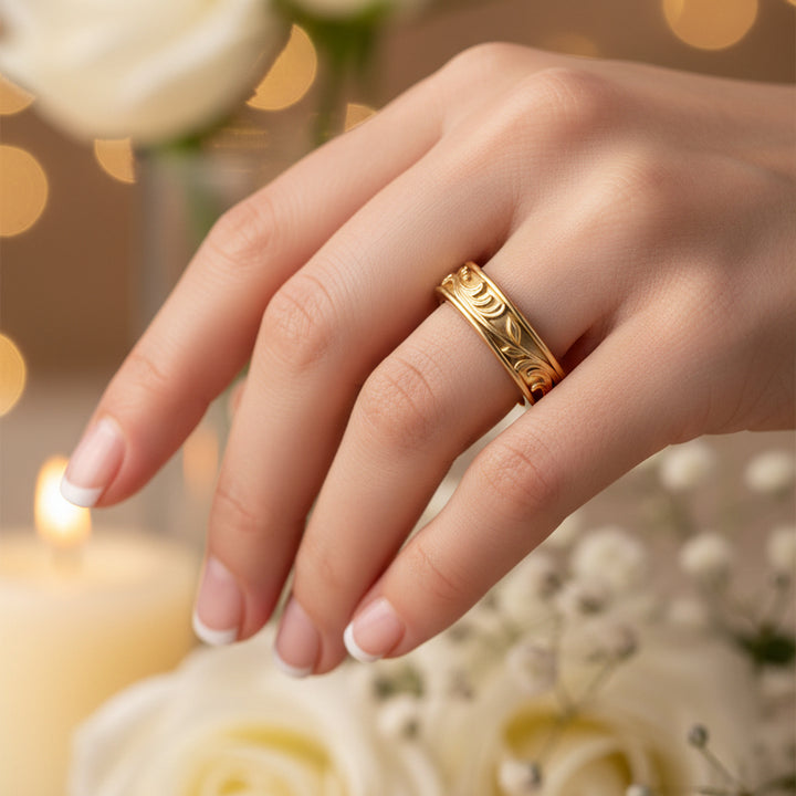 gold rings with intricate designs on a white background